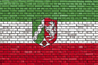 Flag of North Rhine-Westphalia painted on brick wall
