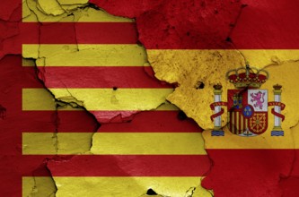 Flags of Sagunto and Spain painted on cracked wall