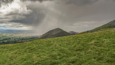 North Pennines landscape, looking at the rain clouds over Dufton Pike in Cumbria, England, UK