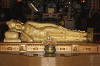 Nirvana, sleeping Buddha sandal wood statue in Horinji Japanese temple, Sarnath, Uttar Pradesh,