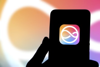 Apple siri logo is displayed on smartphone.