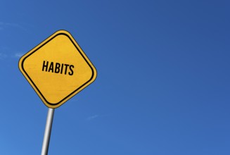 Habits, yellow sign with blue sky
