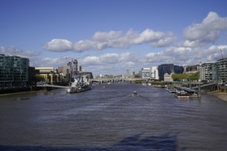 View of the River Thames from Tower Bridge in the City of London with bridges and modern