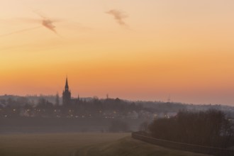 Sunset with the Briesnitz church, large amounts of Sahara dust colour the evening sky particularly