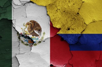 Flags of Mexico and Colombia painted on cracked wall