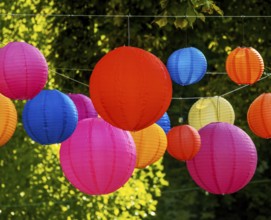 Party with colourful lampions hanging in the garden