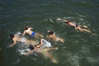 14/06/2018, Porto, Portugal, Europe, Children playing and swimming on the banks of the Duero in