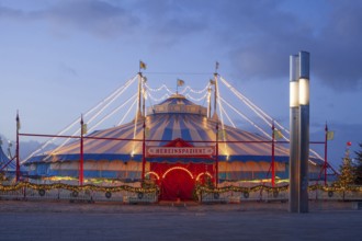 Circus Roncalli with Christmas lights at dusk on the Bürgerweide, Bremen, Germany