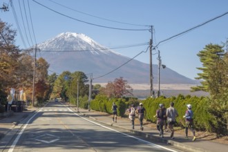Yamanakako, Yamanashi Prefecture, Japan. Nov 5, 2023. Individuals engage in jogging against the