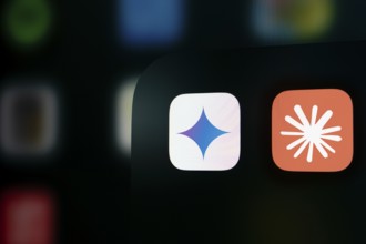 A close up of an iPhone screen displaying the Google Gemini and Claude AI app icon.