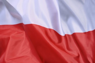 Close-up of the flag of Poland waving in the wind with wave pattern