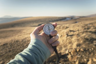 Compass in Hand Natural background .Vintage Tone