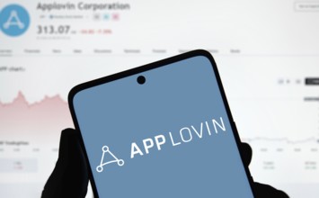 App lovin logo is displayed on smartphone. AppLovin Corporation is an American mobile technology