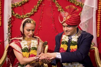 Indian bride and bridegroom holding hand performing vidhi in marriage ceremony MR Bridegroom#729E,
