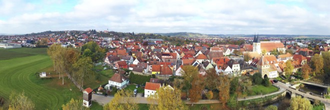 This aerial photo shows the picturesque town of Herrieden. At the centre are the red roofs of the
