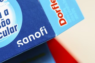 In this photo illustration, the Sanofi logo is seen on the box of the medicine Dorflex, used as an