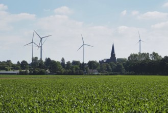 Wind turbines for power generation on the edge of the Garzweiler open-cast lignite mine, with a