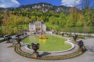 Water parterre with flora fountain and the portal of Linderhof Castle in spring, municipality of