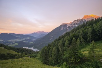 Magical sunset with alpenglow at the Halsalm above Hintersee with views of Hoher Göll and