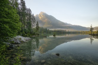 Magical sunrise with fog at Hintersee near Ramsau in Berchtesgadener Land