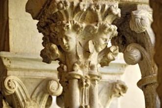 Slender Gothic columns with filigree capitals in the cloister, Gothic basilica of the Cistercian