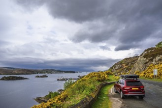 Off road 4x4 car with roof tent over Skye Bridge over Loch Alsh, Kyle of Lochalsh, Isle of Skye,