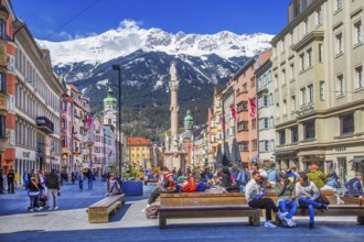 Pedestrian zone Maria-Theresien-Strasse with the Annasäule in front of the Nordkette of the