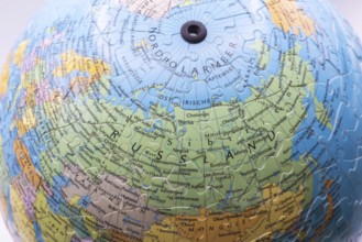 Puzzle globe. Map made from puzzle pieces. Russia