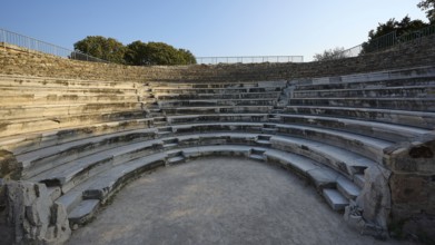 Historic amphitheatre with semi-circular stone steps and intense atmosphere, Ancient Theatre,