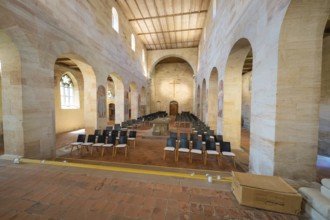Church interior with pews and cross under bright daylight, event and wedding location Lorch