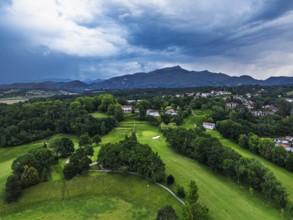 Sunset and storm clouds over Pyrenees and Saint-Jean-de-Luz from a drone, Nouvelle-Aquitaine,