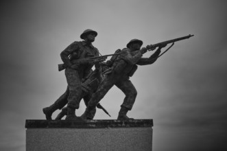 Three fighting soldiers, sculpture, British Normandy Memorial, war memorial, black and white,