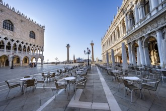 Chairs and tables of cafes at Piazetta San Marco, Doge's Palace and Colonna di San Marco and