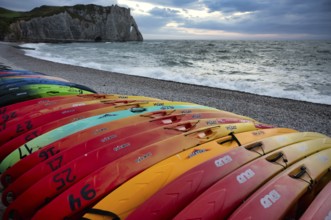 Kayaks, boats, colourful, lying on the beach, pebble beach, rock arch Falaise or Porte d'Aval,