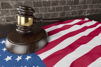 American flag and wooden gavel resting on desk