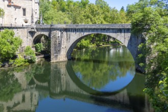 Historic bridge reflected in water of River Tamega, Amarante, Tâmega e Sousa, Portugal