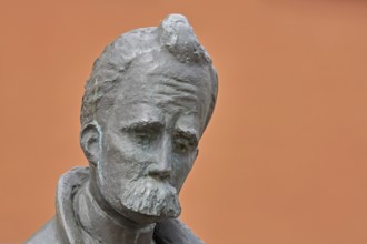 Monument to philosopher Friedrich Nietzsche, bronze sculpture, modern art, man with beard, head,