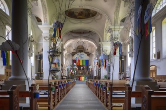 Interior view of nave, choir, altar, Peter and Paul parish church, decorated for First Communion,