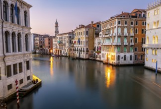 View of the Grand Canal at sunset, picturesque evening mood with illuminated palazzos on the canal