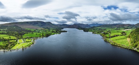 Panorama of Farms and mountains over Ullswater Lake from drone, Pooley Bridge, Lake District