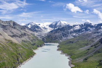 Blue mountain lake in a mountain landscape with glaciers, Lac des Dix reservoir and Mont Blanc de