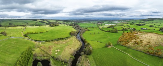 Panorama of Farms over Ullswater Lake from drone, Pooley Bridge, Lake District National Park,