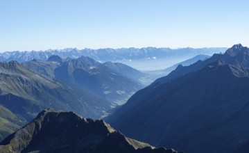 View of the Stubai Valley, mountain silhouettes, from the summit of the Wilder Freiger, Stubai