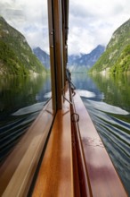 Mountains and lake reflected in the windscreen of the excursion boat at Königssee, Berchtesgaden
