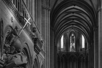 Interior view, angel on pulpit, holding a shining sword, Cathédrale Notre-Dame de Bayeux, black and