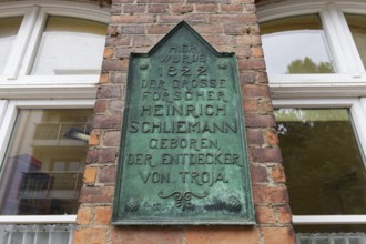 Plaque in the birthplace of Heinrich Schliemann, discoverer of Troy, Neubukow, district of Rostock,