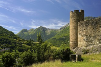 The ruins of the Château Sainte-Marie castle in Esterre and the mountain landscape near