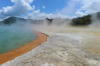 Geothermal pool with steam and a rocky environment, Champagne Pool thermal lake, Wai-O-Tapu Thermal