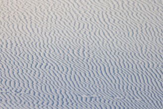 Wind creates wave patterns in the sand dunes at White Sands National Park in Alamogordo, New