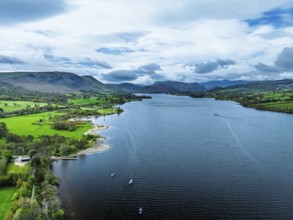Farms and mountains over Ullswater Lake from drone, Pooley Bridge, Lake District National Park,
